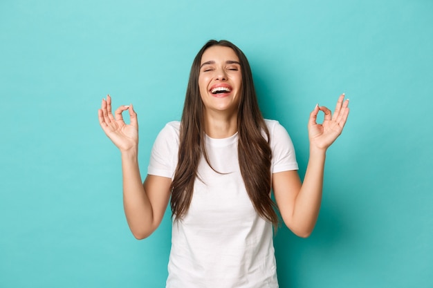 Young woman in white T-shirt posing