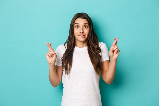 Young woman in white T-shirt posing