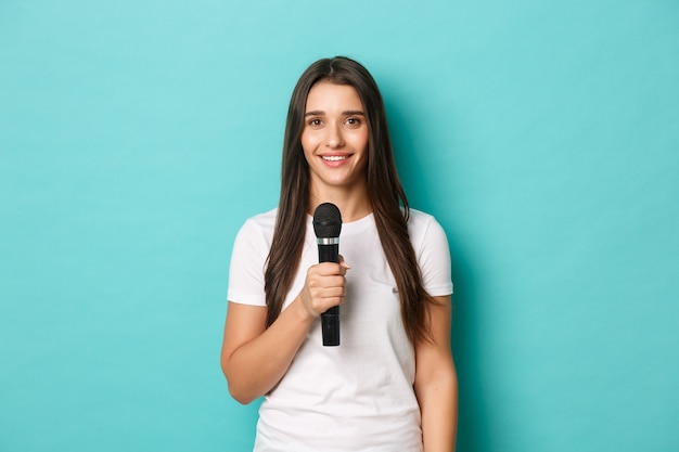 Young woman in white T-shirt posing