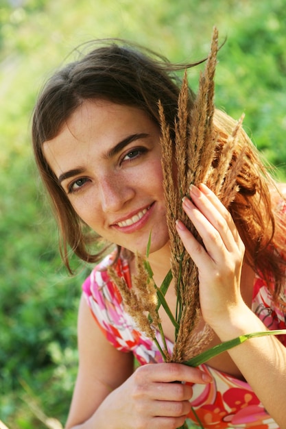 Young woman and wild flowers