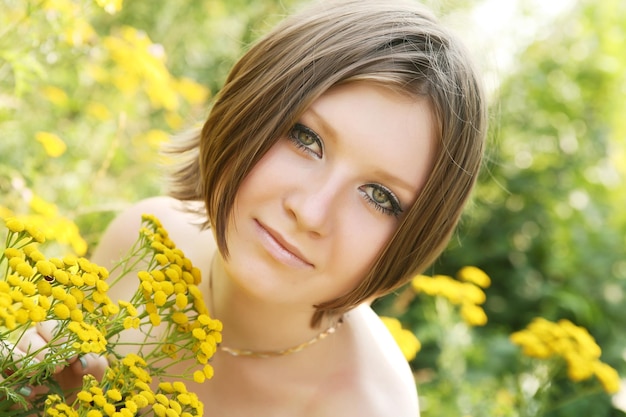 Young woman and wild flowers