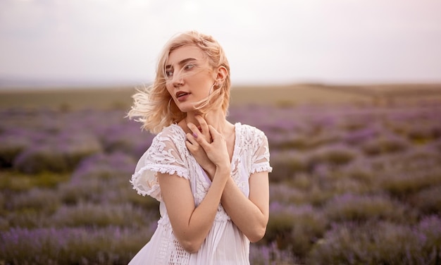 Young woman on windy day in lavender field