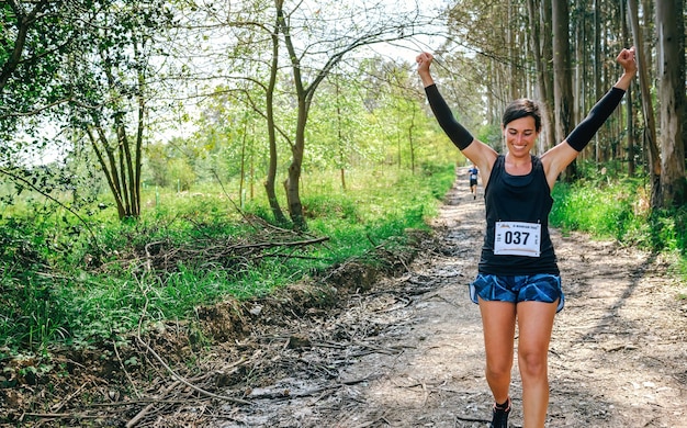 Young woman winning trail race