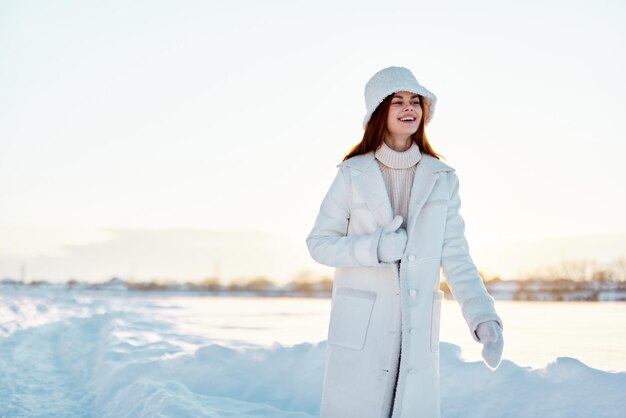 Young woman winter clothes walk snow cold vacation\
lifestyle