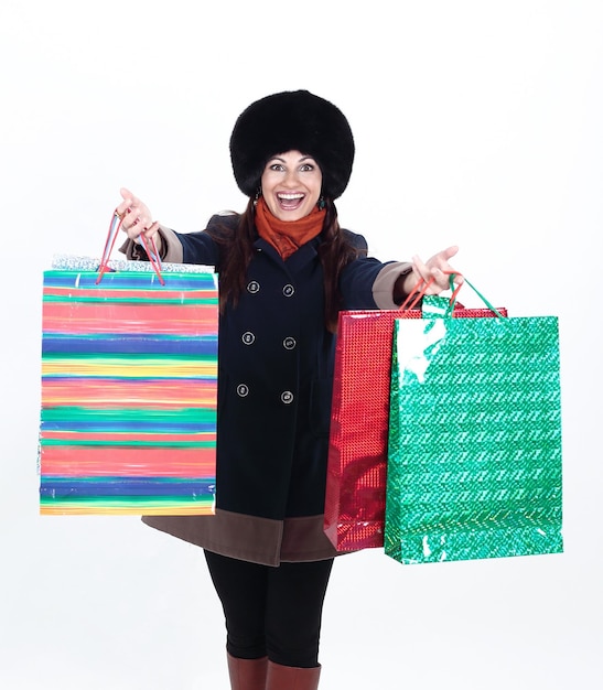 Young woman in winter clothes with shopping bags