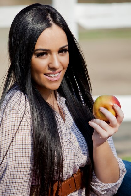 Young woman with an apple