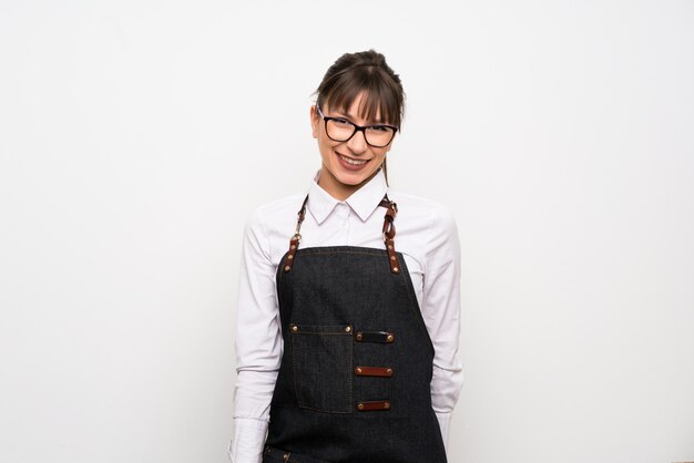 Young woman with apron smiling