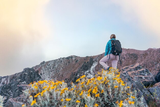 Young woman with backpack in malinche volcano