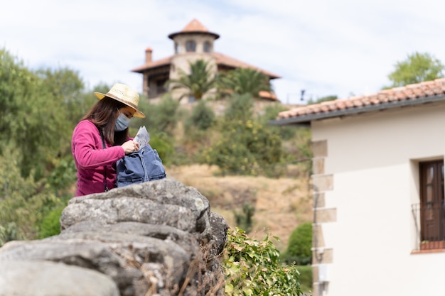 Young woman with a backpack on a trip