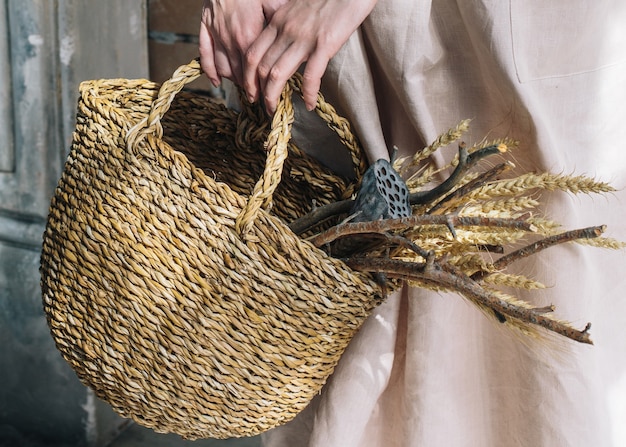 young woman with basket in her hands