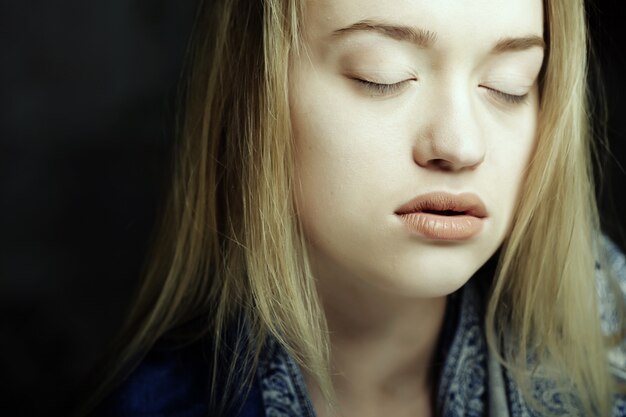 Young woman with beautiful blue eyes