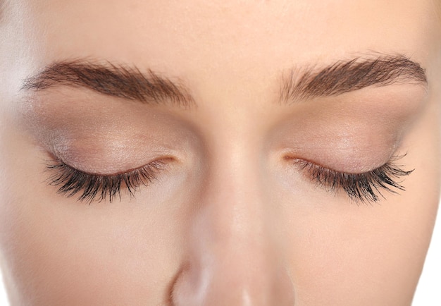 young woman with beautiful natural eyelashes closeup view
