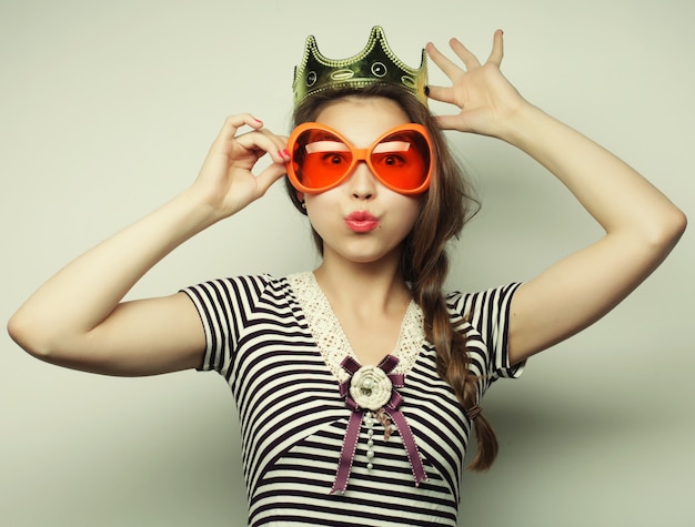 Young woman with big party glasses