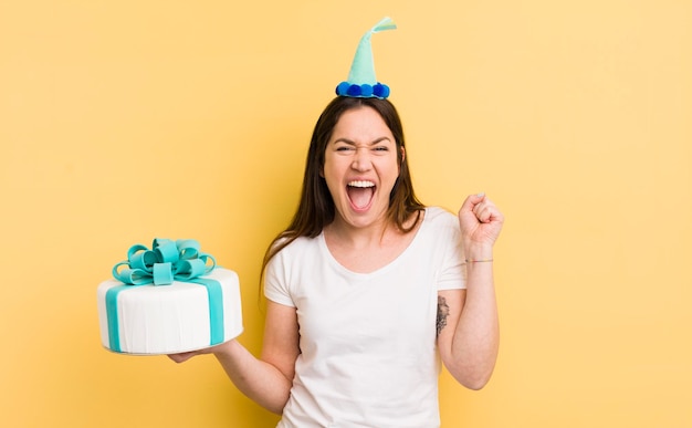 Young woman with a birthday cake