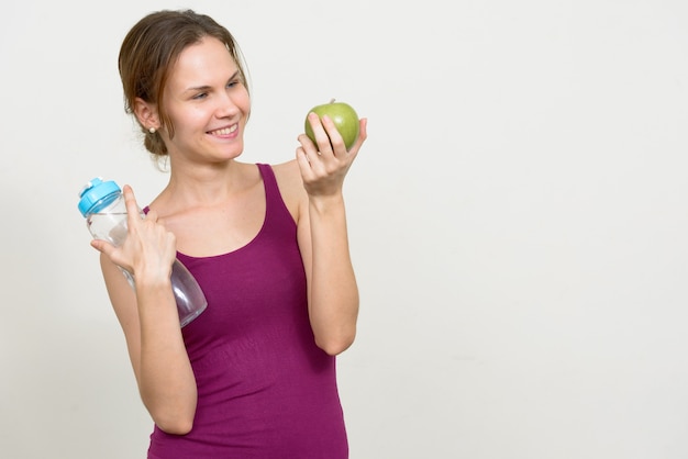 young woman with blond hair ready for gym white