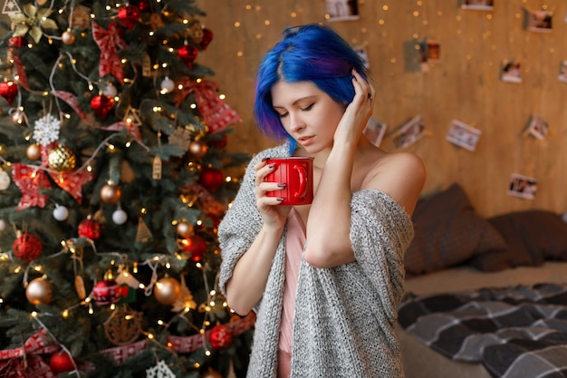 Young woman with blue hair on Christmas