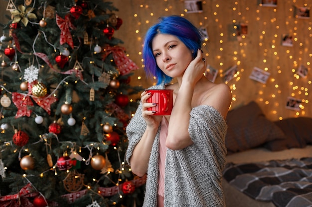 Young woman with blue hair on Christmas