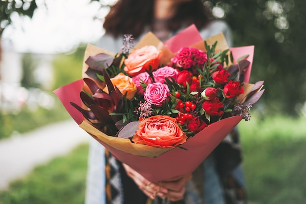 Young woman with bouquet of flowers