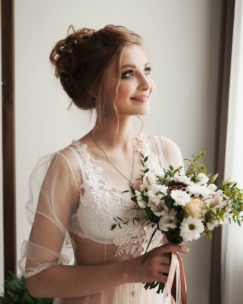 young woman with bouquet on her wedding day.