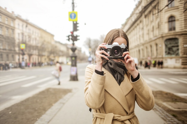 Young woman with a camera