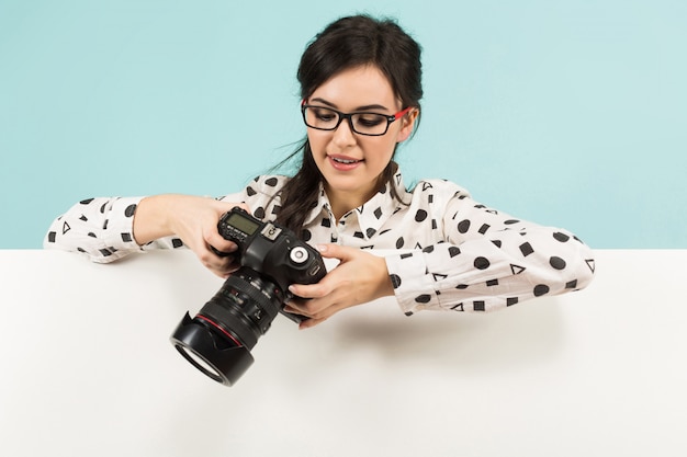 Young woman with camera