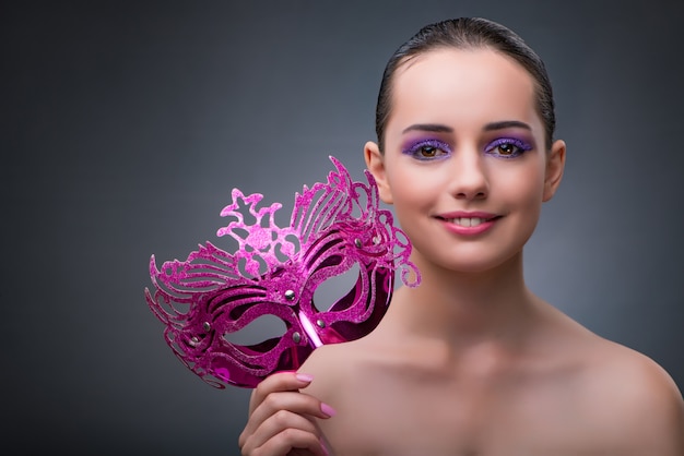 Premium Photo | Young woman with carnival mask