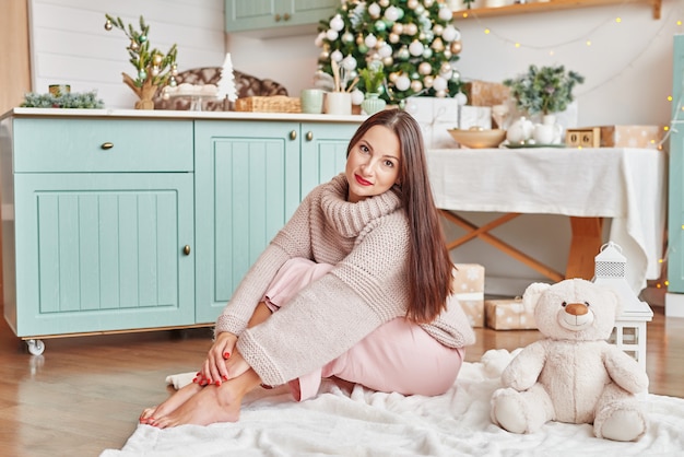 Young woman with christmas tree