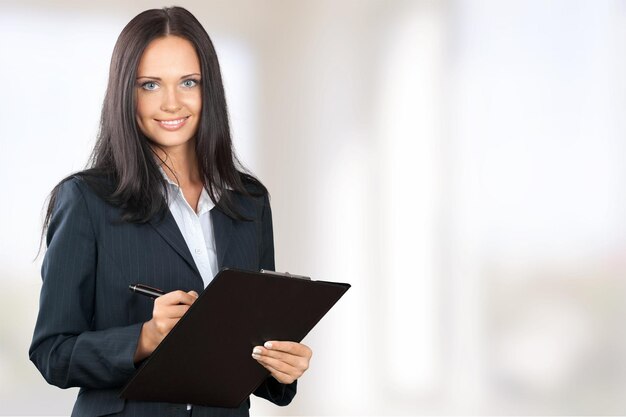 Young woman with clipboard in her hands