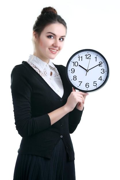 Young woman with clock isolated on white