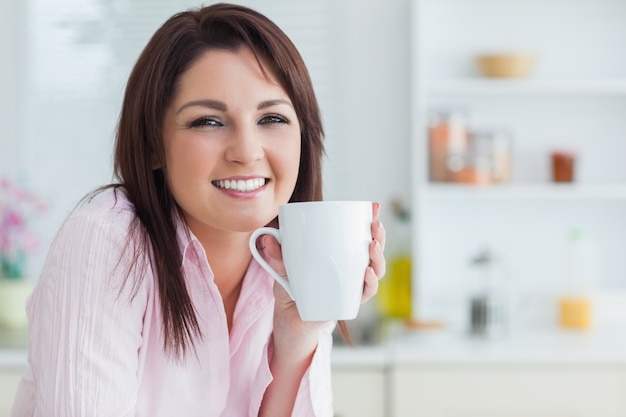 Young woman with coffee cup