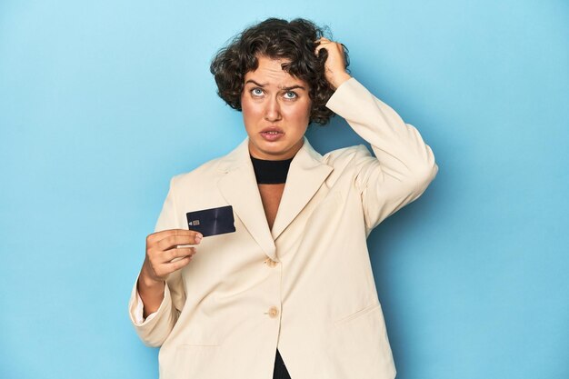 Photo young woman with credit card elegant white blazer being shocked she has remembered important meeting