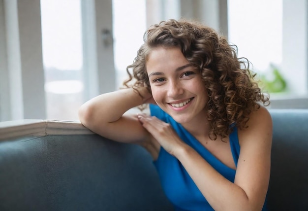 a young woman with curly hair is sitting on a bench