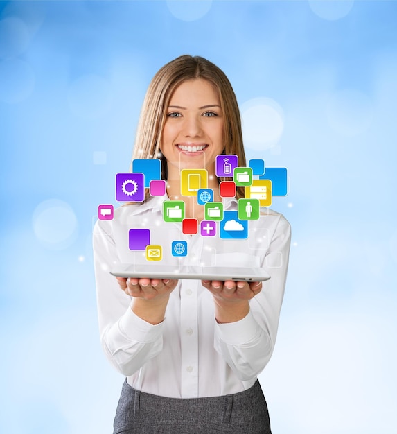 Young woman with digital tablet, icons out of screen