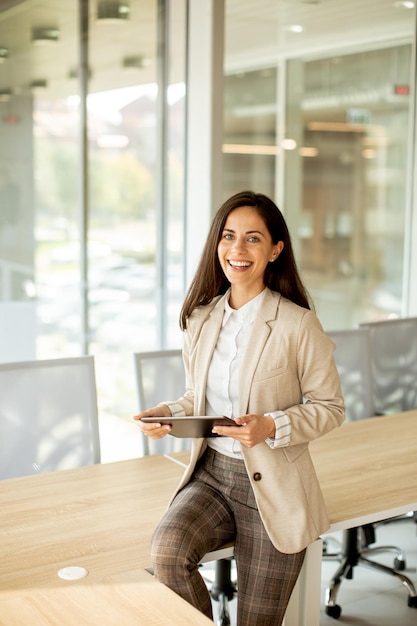 Young woman with digital tablet in the office