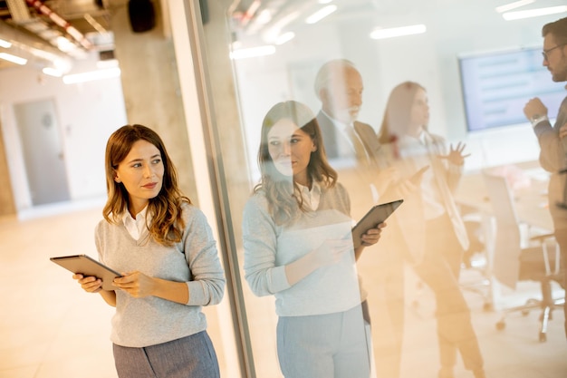 Young woman with digital tablet in the office