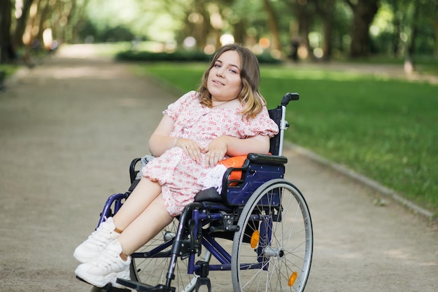 Young woman with disability enjoying fresh air at green park