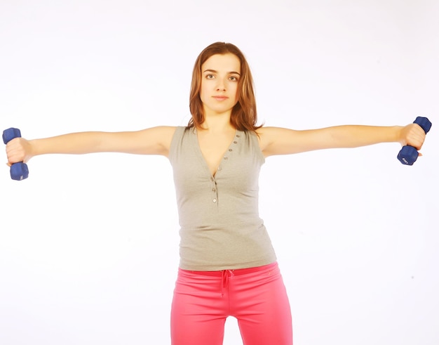 Young woman with dumbbells