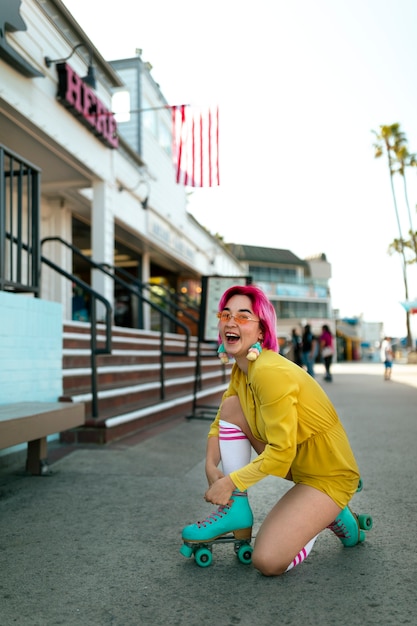 Young woman with dyed hair near shop