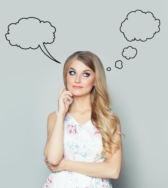 Young woman with empty speech cloud bubble