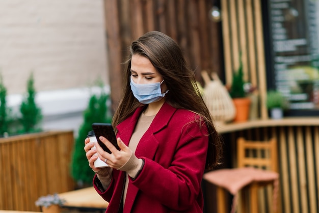 Young woman with a face mask in restaurant, New normal concept for protect coronavirus pandemic