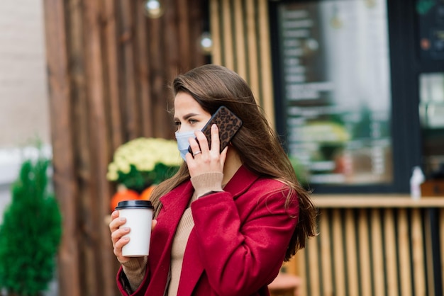 Young woman with a face mask in restaurant New normal concept for protect coronavirus pandemic