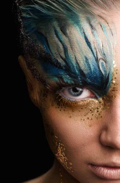 Young woman with fantasy make up. Close up