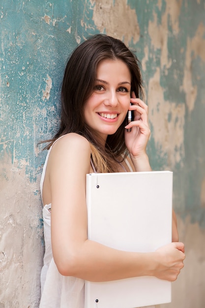 Young woman with file