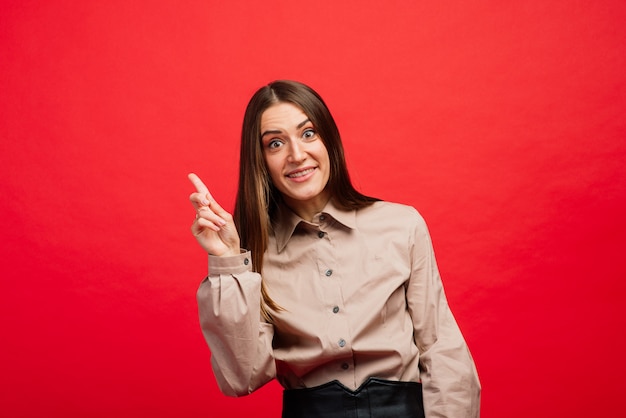 young woman with fingers crossed