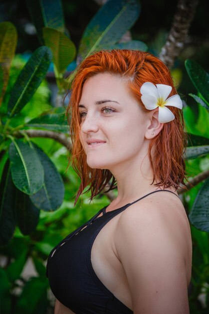 Young woman with a flower in her hair