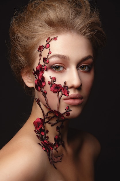 Young woman with flower makeup