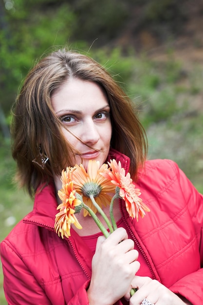 Young woman with flowers outdoor