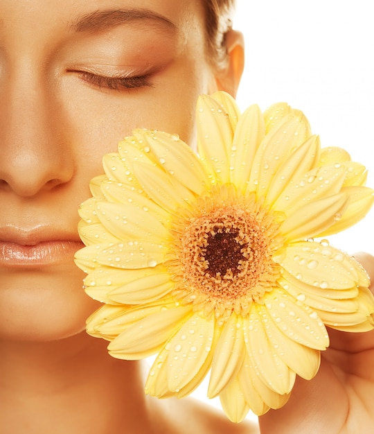 young woman with gerber flower isolated