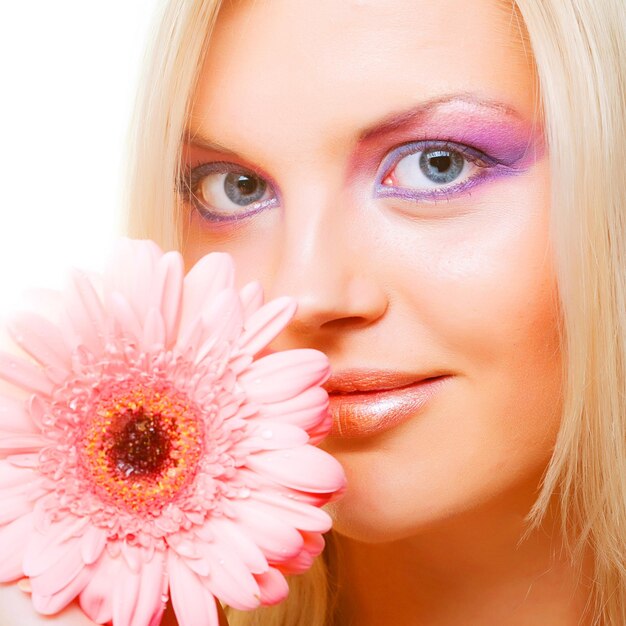 Young woman with gerber flower