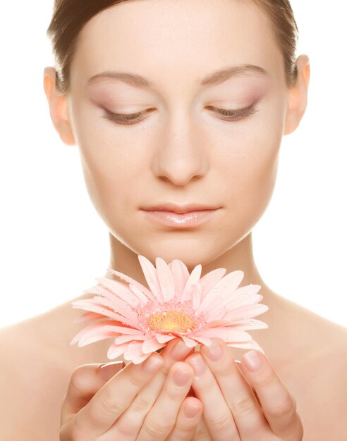 Young woman with gerber flower